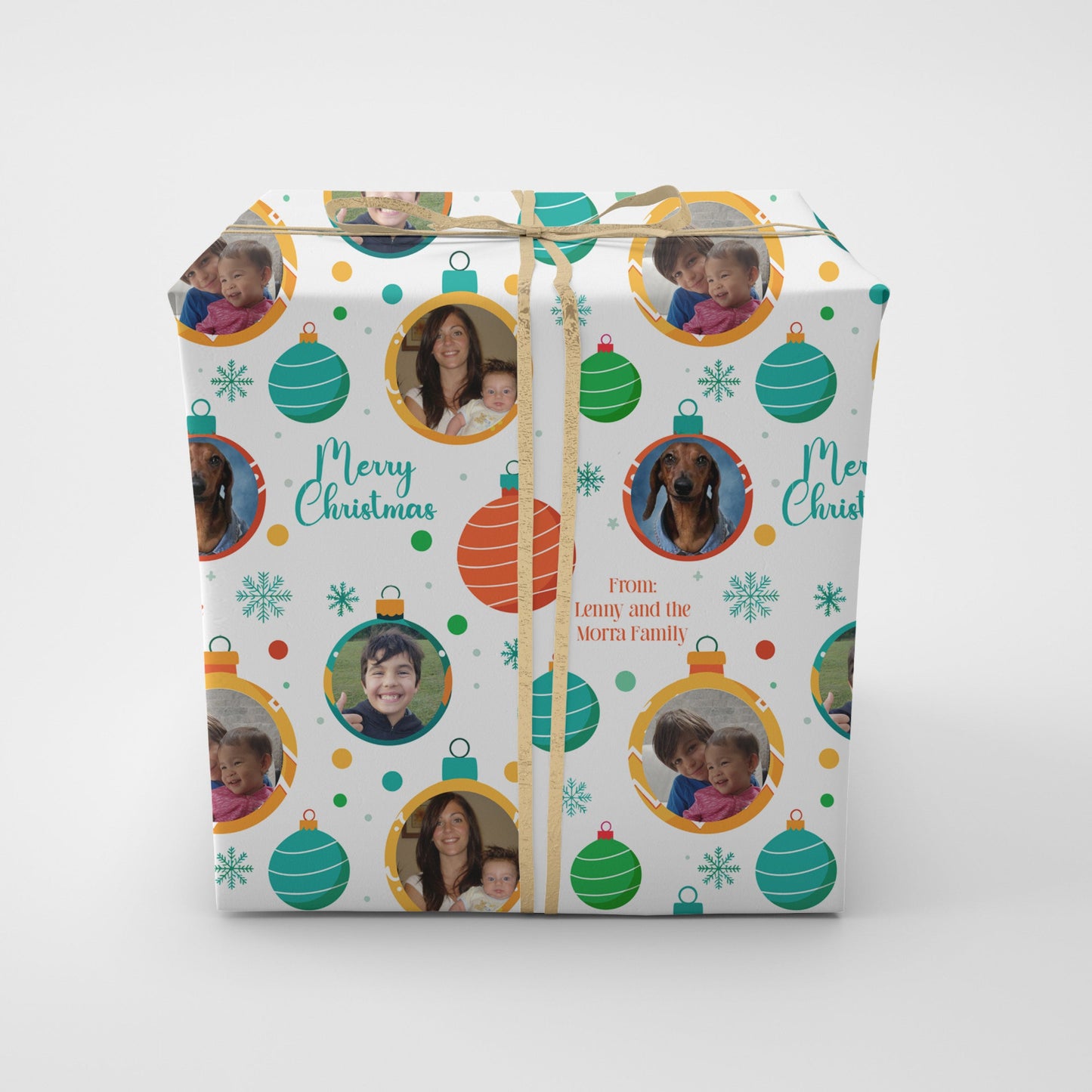 Gift wrap with holiday themed wrapping paper featuring photos of your family and christmas themed design